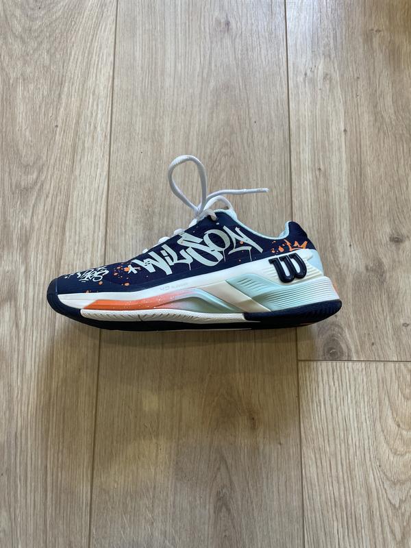 Image de Wilson - Chaussures de Tennis Rush Pro 4.0 Paris Hope Bleu/Orange disponible sur ekwip