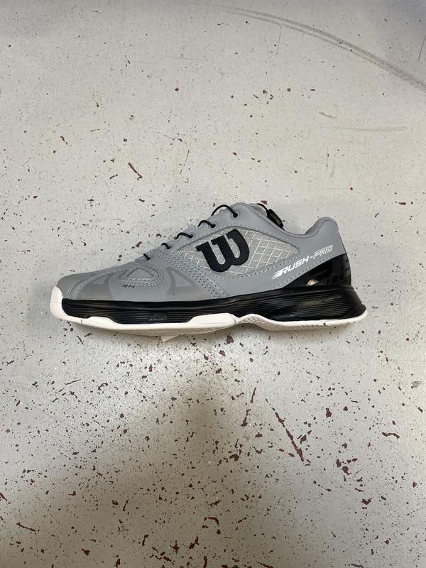 Image de Wilson - Chaussures de Tennis Rush Pro JR QL Quarry/Black/White disponible sur ekwip